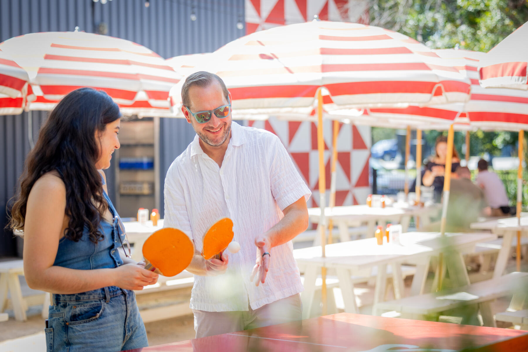 Friends play pingpong at Parsons Chicken and Fish Chicago